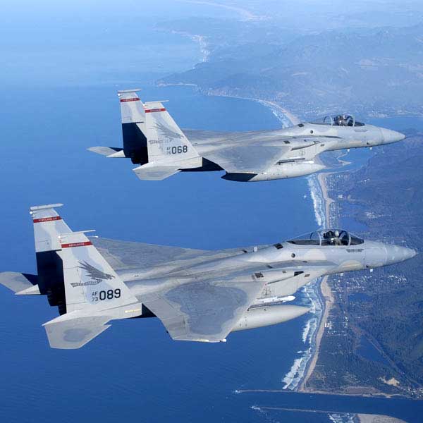 Two Fighter Jets FLying Over the Coast